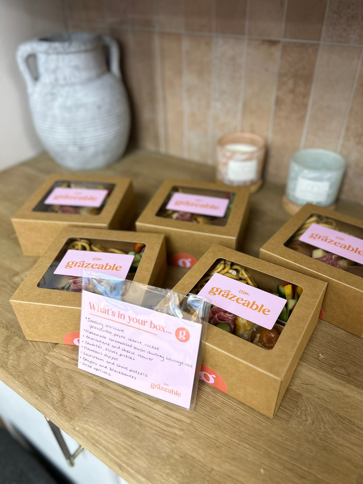Boxed snacks with 'Grazable' branding on a wooden surface.